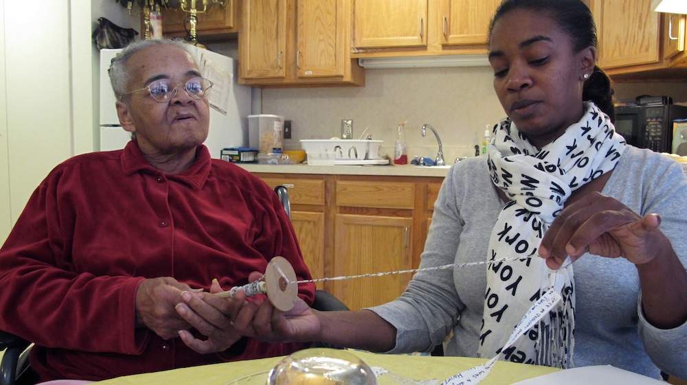 Lois Jones spins her yarn with help from her granddaughter Dhonyale